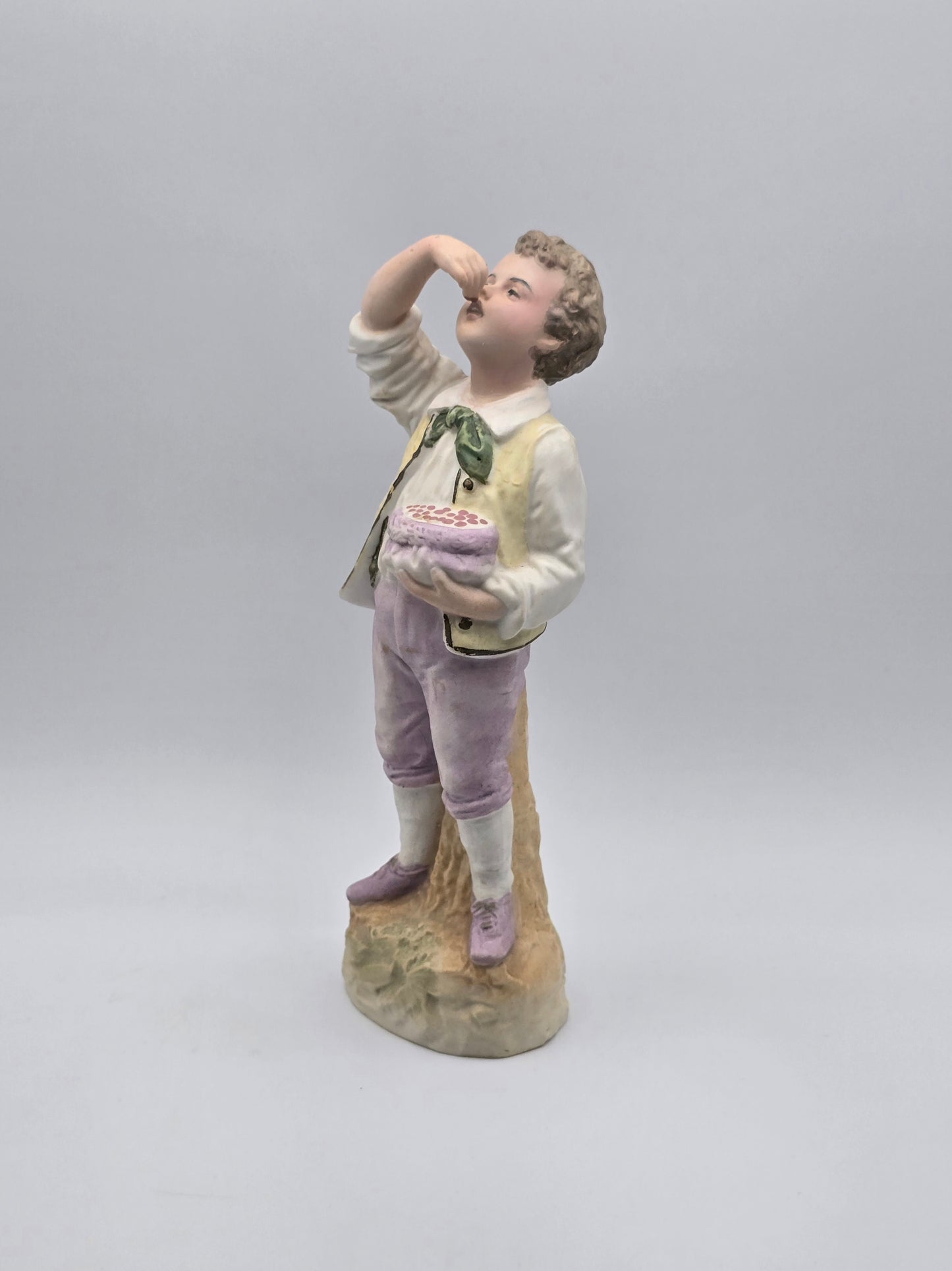 Vintage Gebruder Heubach Figurine. Young Boy Eating Fruit From His Bag.