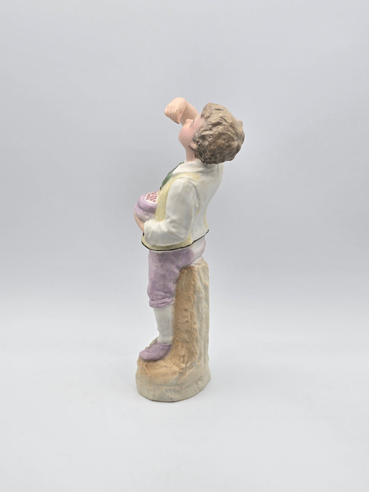 Vintage Gebruder Heubach Figurine. Young Boy Eating Fruit From His Bag.