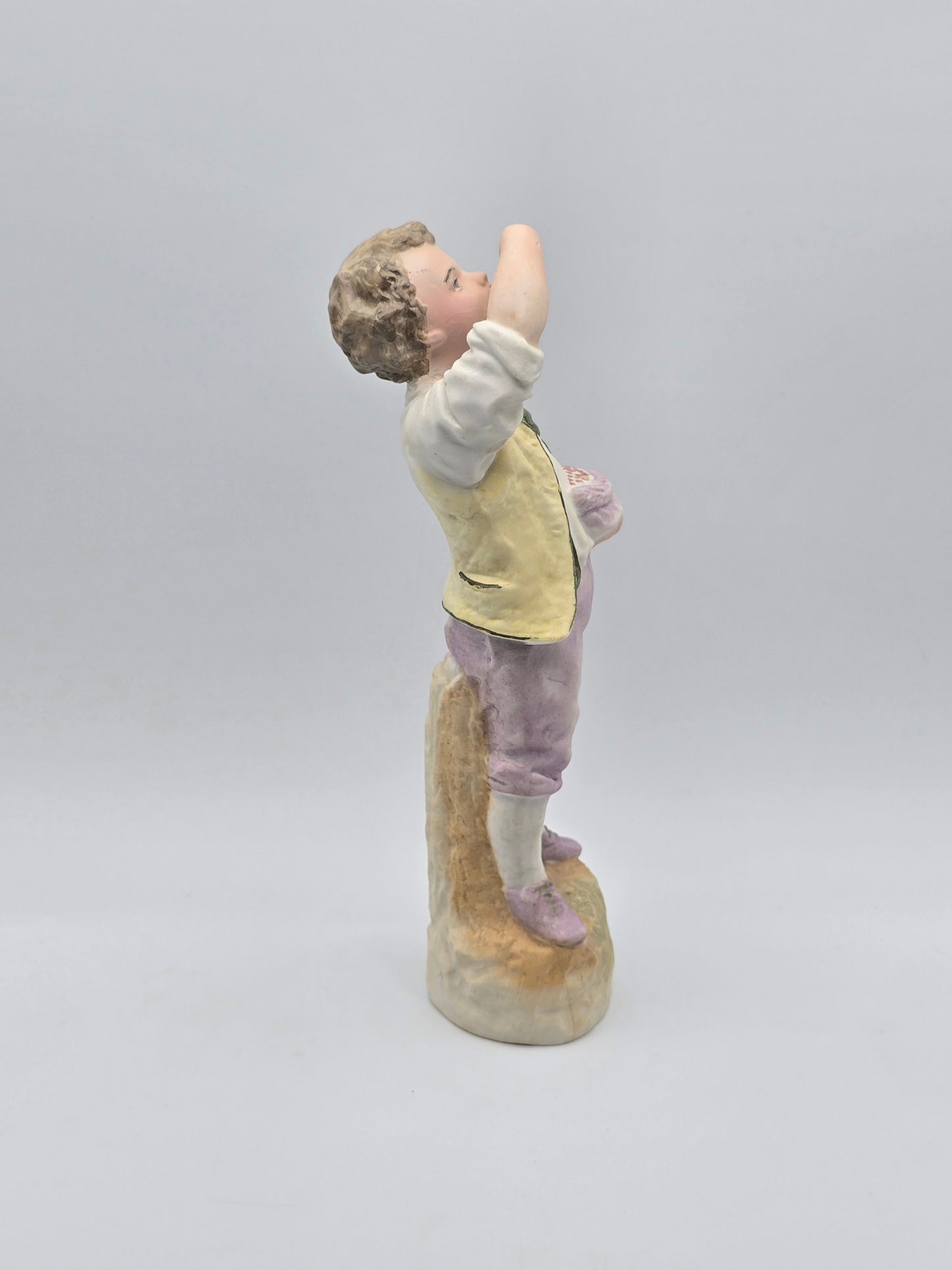 Vintage Gebruder Heubach Figurine. Young Boy Eating Fruit From His Bag.