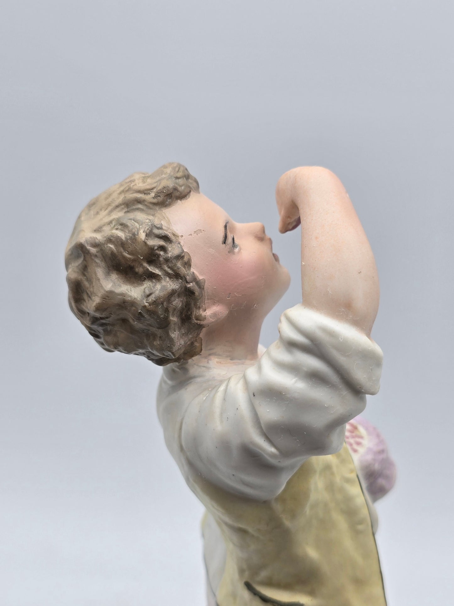Vintage Gebruder Heubach Figurine. Young Boy Eating Fruit From His Bag.