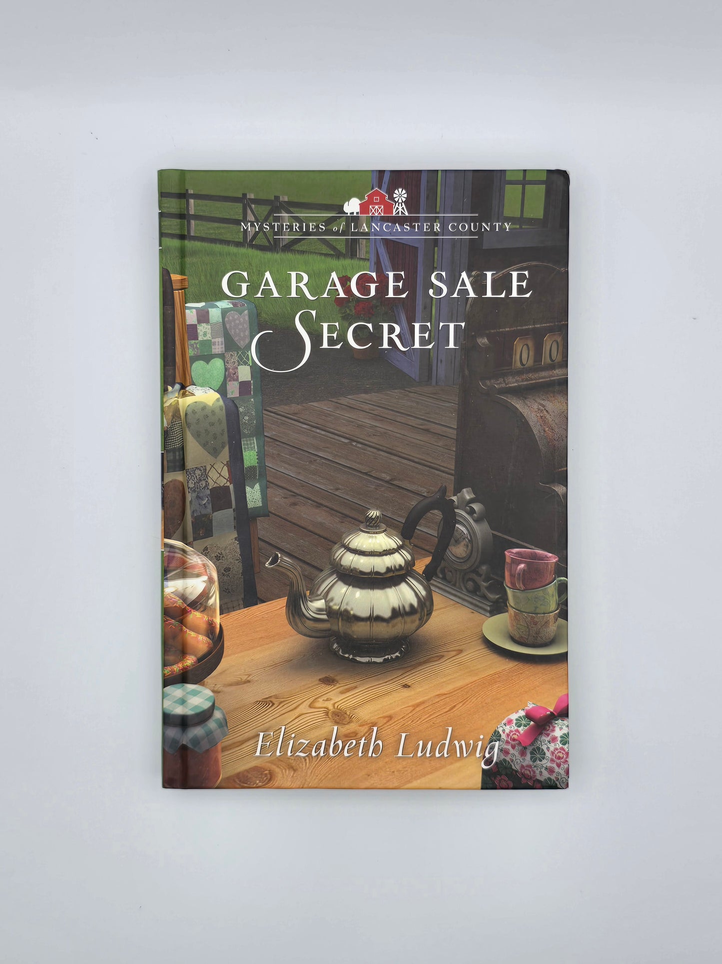 Mysteries of Lancaster County, NC.Garage Sale Secret By Elizabeth Ludwig. Hardcover book, New York 2019.