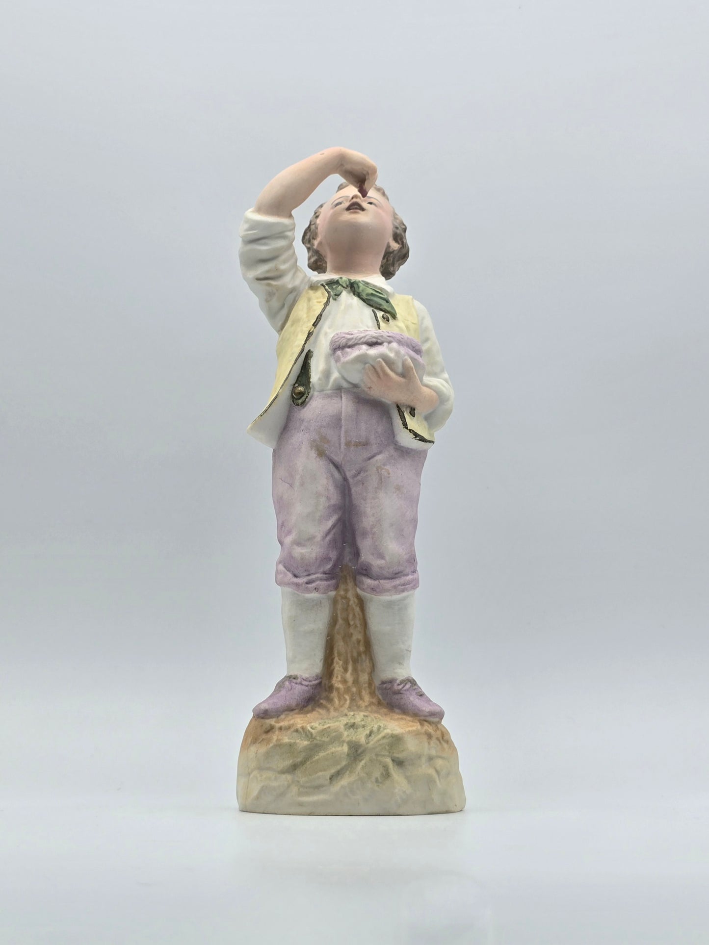 Vintage Gebruder Heubach Figurine. Young Boy Eating Fruit From His Bag.