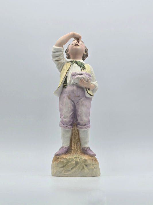 Vintage Gebruder Heubach Figurine. Young Boy Eating Fruit From His Bag.