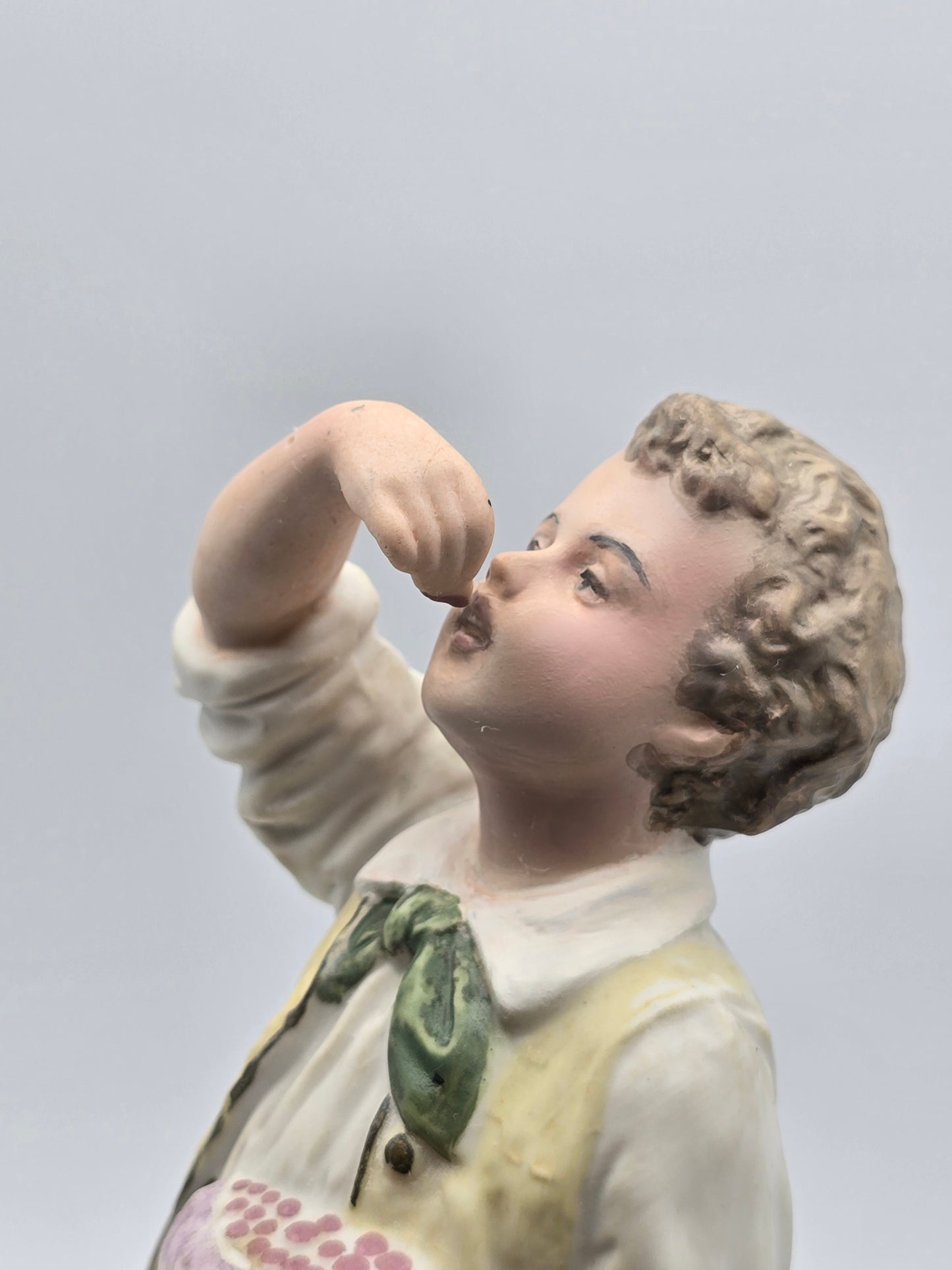 Vintage Gebruder Heubach Figurine. Young Boy Eating Fruit From His Bag.